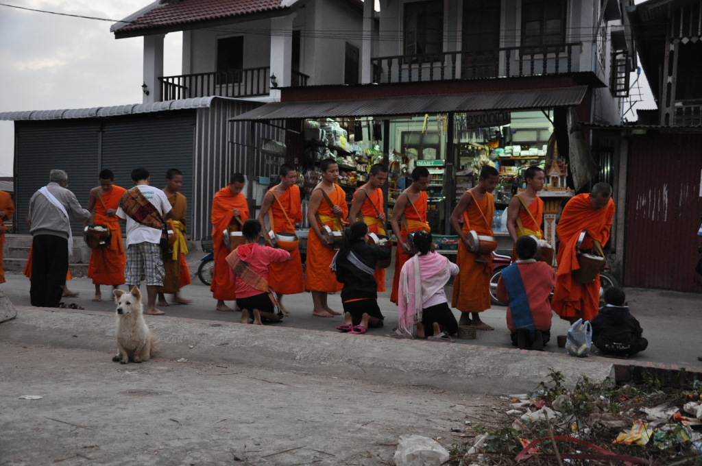 a group of people in orange robes